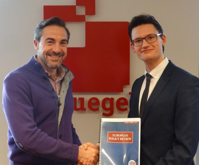 Our presenter, Matt Dann, on the right is receiving the first copy of the the first issue of the European Policy Review from European Student Think Tank President. 
